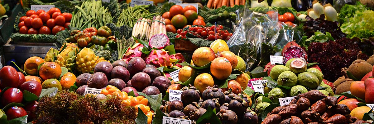 produce section at a supermarket with a great many choices