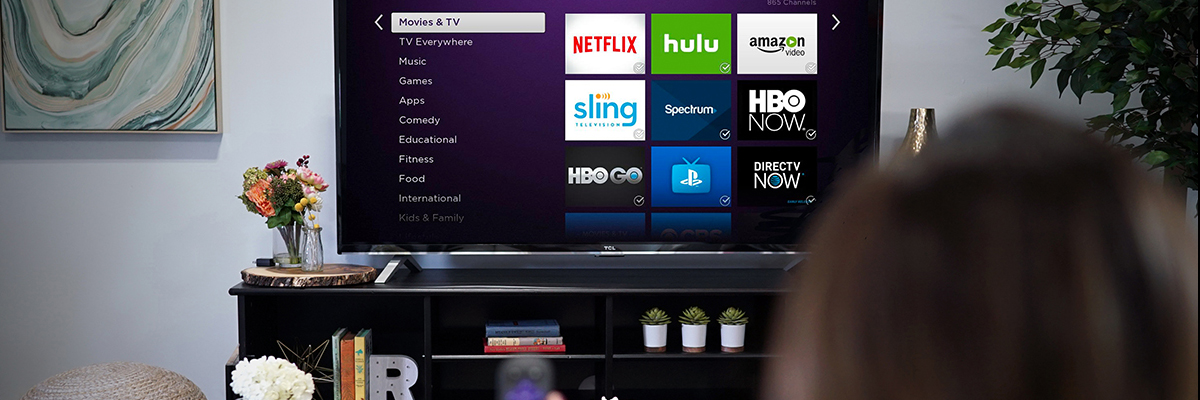 smart TV with 9 apps displayed on the screen next to a menu