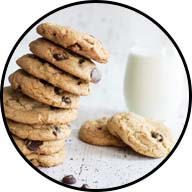 stack of cookies with glass of milk