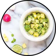 bowl of lettuce tossed with cooked vegetables